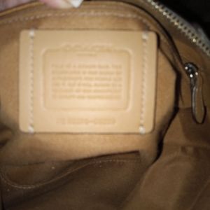 Coach with shoulder strap